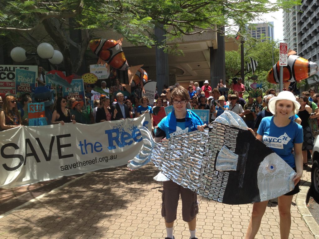 Protestors signed an over-sized fish at Save the Great Barrier Reef protest outside the Queensland Government's executive building in Brisbane. Protestors signed an over-sized fish at Save the Great Barrier Reef protest outside the Queensland Government's executive building in Brisbane.