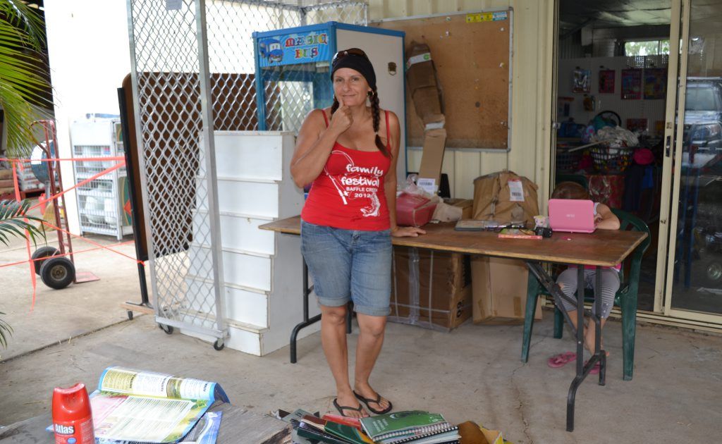 WIPED OUT: Jodie Healy was sorting through the mud and destroyed books at Bafflelink yesterday. WIPED OUT: Jodie Healy was sorting through the mud and destroyed books at Bafflelink yesterday.