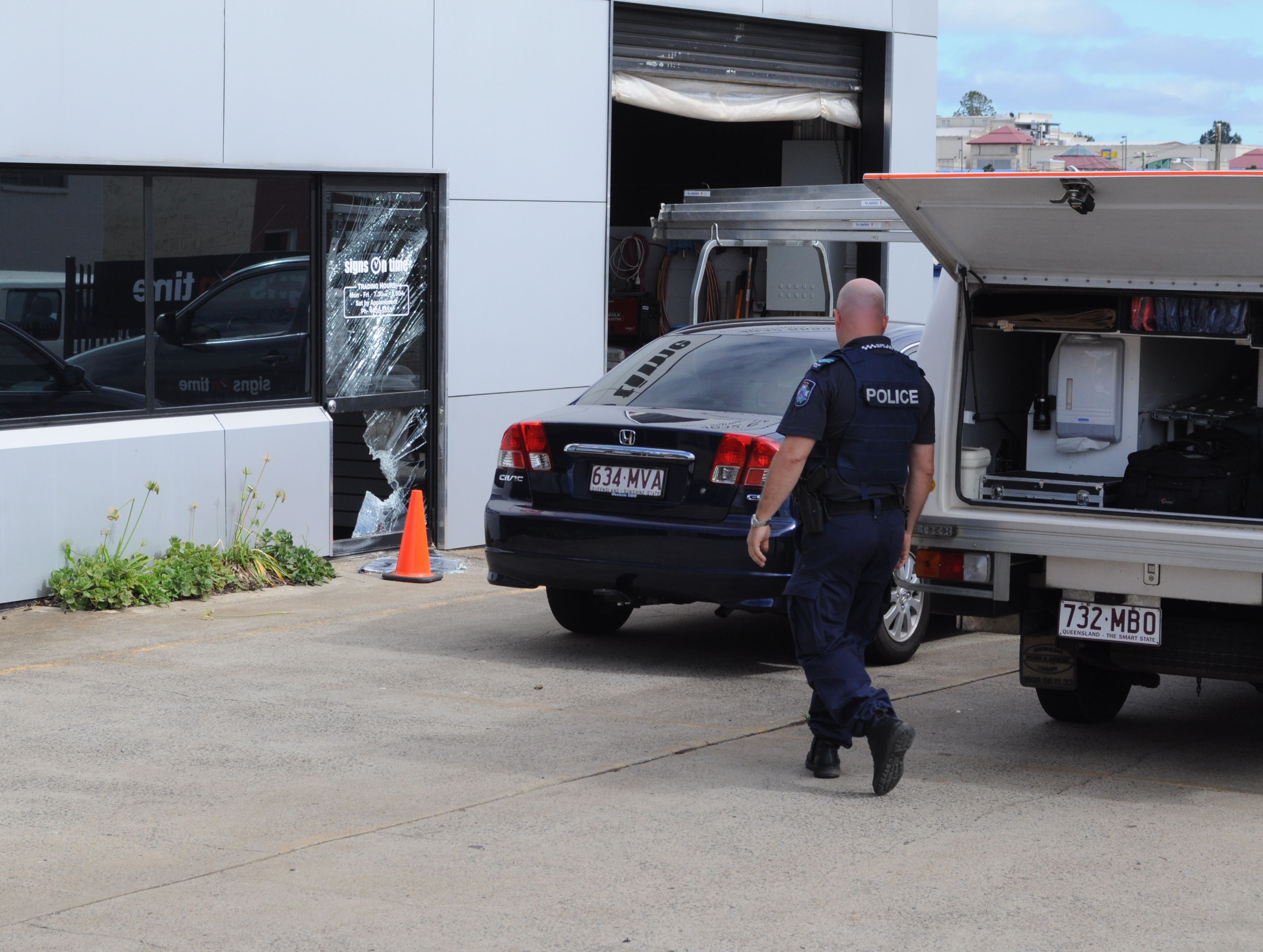 Police forensic crews assess the scene of a possible break and enter at a Wylie St business.