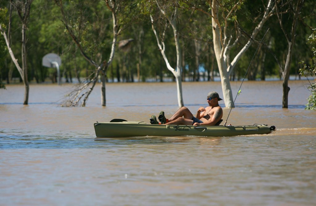 A fishing kayak makes its way around flooded Depot Hill as the Fitzroy River approaches 8.6m. Photo: Chris Ison / The Morning Bulletin A fishing kayak makes its way around flooded Depot Hill as the Fitzroy River approaches 8.6m. Photo: Chris Ison / The Morning Bulletin