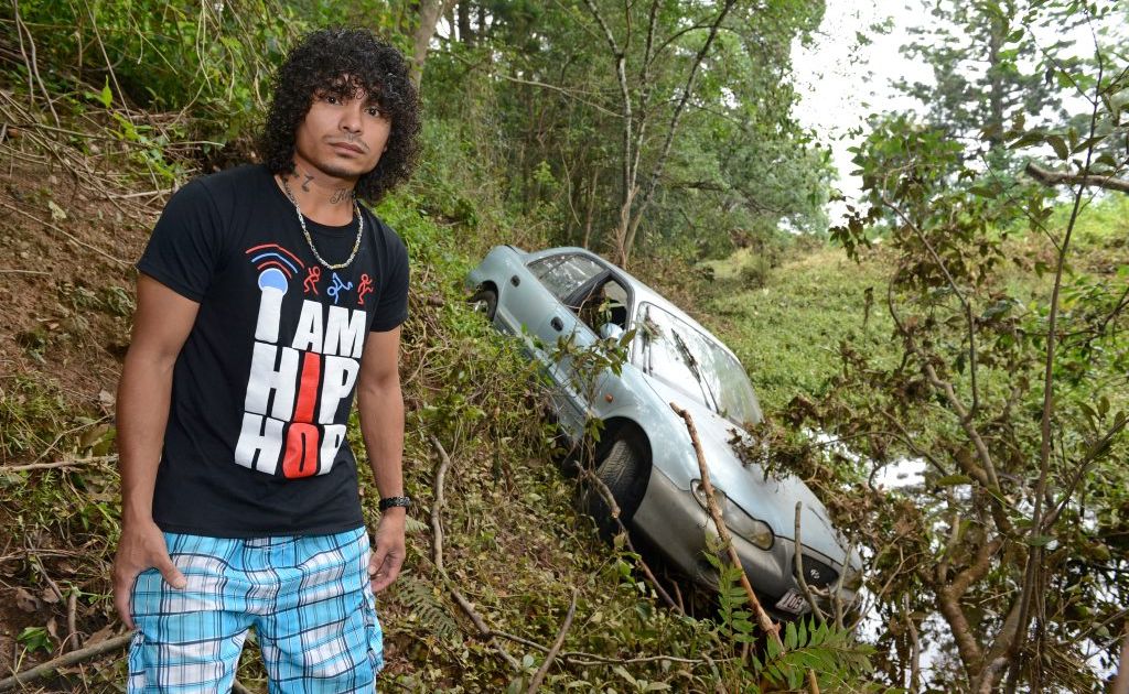 Armando Laarhoven with his car that was washed into the river. Photo: John Gass / Daily News Armando Laarhoven with his car that was washed into the river. Photo: John Gass / Daily News