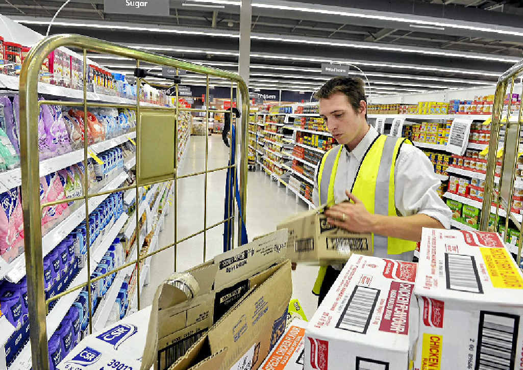 GEARING UP: A Coles worker stacks the shelves at the new Ipswich superstore ahead of today’s grand opening. GEARING UP: A Coles worker stacks the shelves at the new Ipswich superstore ahead of today’s grand opening.
