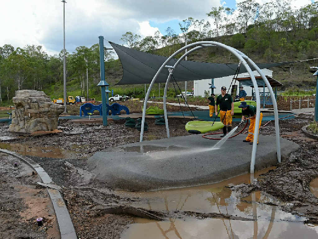 FAMILIAR SIGHT: The fire brigade helps with the flood clean-up at Colleges Crossing. FAMILIAR SIGHT: The fire brigade helps with the flood clean-up at Colleges Crossing.