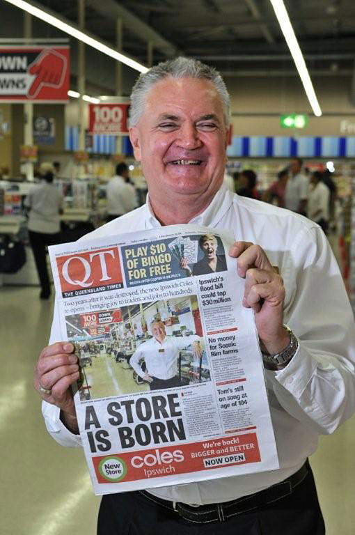 Coles Ipswich manager Ken Lothian holding Wednesday's edition of the QT at the official opening of the new store. Coles Ipswich manager Ken Lothian holding Wednesday's edition of the QT at the official opening of the new store.