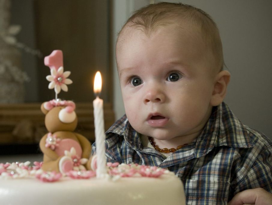 Hayden Crowton has his first go at blowing out a candle at Toowoomba cake business KAF Kreations.