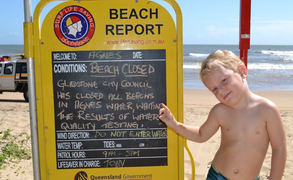 NOT AGAIN: Charlie Lockwood, 3, and his mum and dad couldn't believe the beach at Agnes Water was closed again yesterday during their annual holiday. Photo Rob Black / The Observer NOT AGAIN: Charlie Lockwood, 3, and his mum and dad couldn't believe the beach at Agnes Water was closed again yesterday during their annual holiday. Photo Rob Black / The Observer