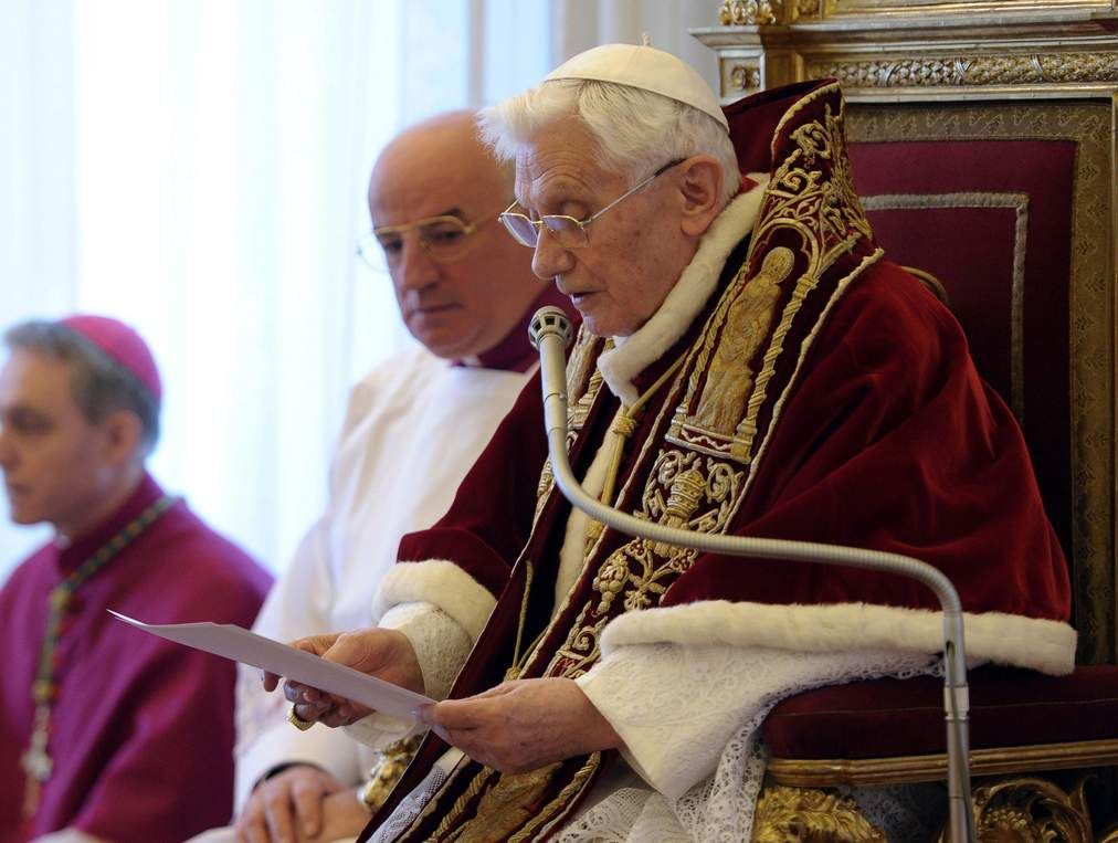 Pope Benedict XVI reads a document in Latin where he announces his resignation, during a meeting of Vatican cardinals, at the Vatican. Pope Benedict XVI reads a document in Latin where he announces his resignation, during a meeting of Vatican cardinals, at the Vatican.