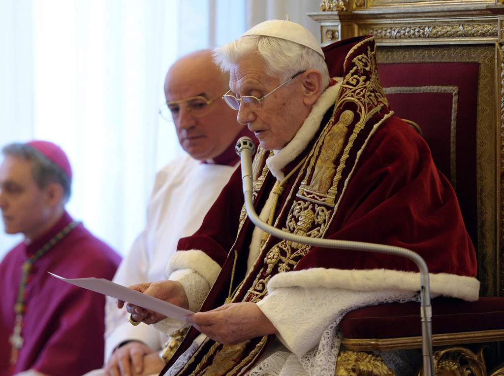 Pope Benedict XVI reads a document in Latin where he announces his resignation, during a meeting of Vatican cardinals, at the Vatican. Pope Benedict XVI reads a document in Latin where he announces his resignation, during a meeting of Vatican cardinals, at the Vatican.