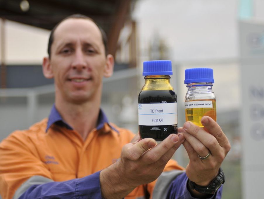 QER general manager Chris Anderson showcases the company's first bottle of oil from a demonstration plant near Fishermans Lane, Gladstone, in 2011. QER general manager Chris Anderson showcases the company's first bottle of oil from a demonstration plant near Fishermans Lane, Gladstone, in 2011.