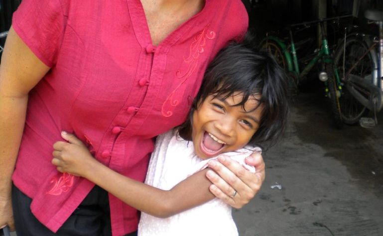 Jenny Christie with one of the Kindy kids from New Hope Cambodia. Photo: Contributed Jenny Christie with one of the Kindy kids from New Hope Cambodia. Photo: Contributed