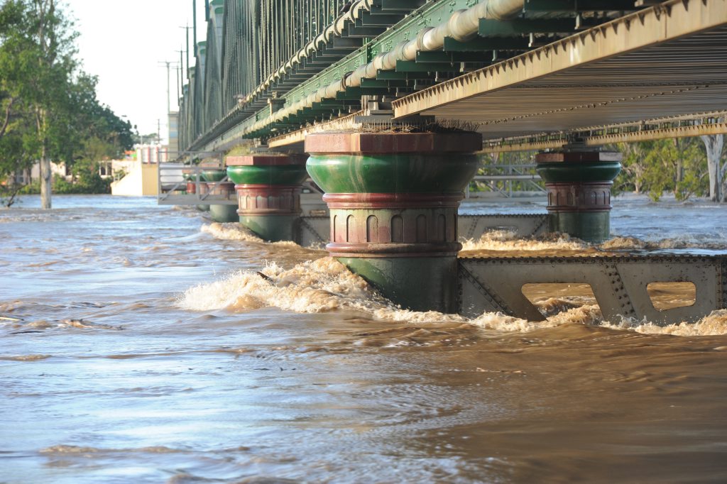 STRONG TIDE: Burnett River traffic bridge holds tight against the raging waters of the 2013 flood. Photo: Ben Turnbull / NewsMail STRONG TIDE: Burnett River traffic bridge holds tight against the raging waters of the 2013 flood. Photo: Ben Turnbull / NewsMail