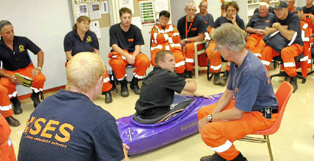 KAYAK RESCUE: Trainer Phil Benfield passes on some tips on handling a kayak to rescue volunteers from police, SES, ambulance, helicopter and road accident crews. KAYAK RESCUE: Trainer Phil Benfield passes on some tips on handling a kayak to rescue volunteers from police, SES, ambulance, helicopter and road accident crews.
