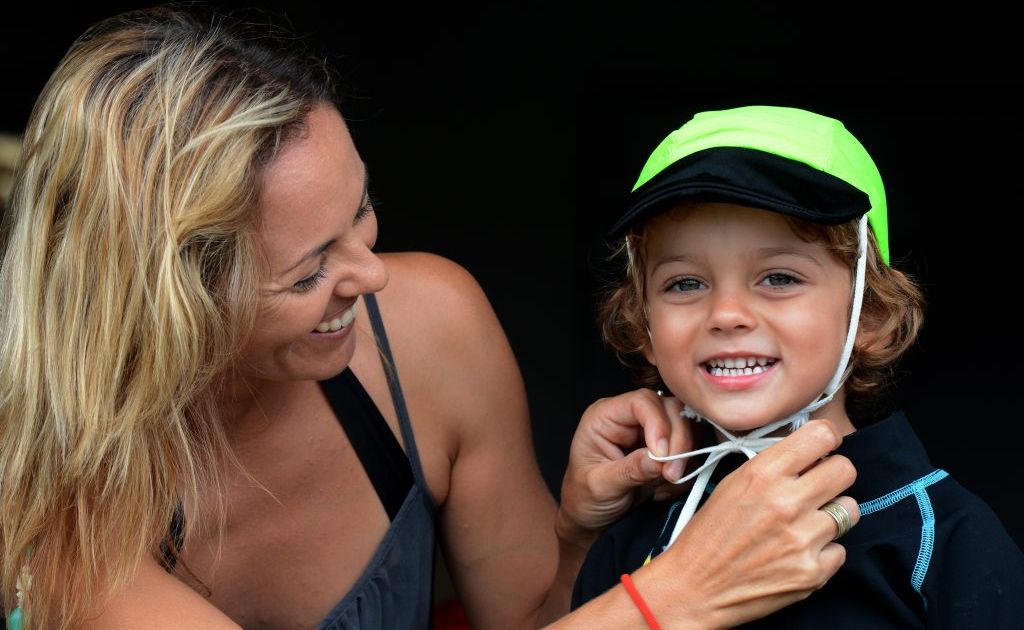 Nicole Bushnell and son Miles with one of the new visor caps. Nicole Bushnell and son Miles with one of the new visor caps.
