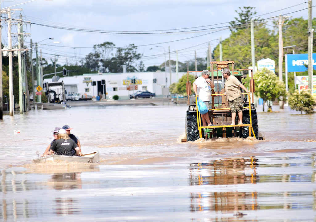 BUNDY BATTLES: People make their way through floodwater in East Bundaberg. About 1200 people stayed in evacuation centres after 2000 homes succumbed to raging floodwater. BUNDY BATTLES: People make their way through floodwater in East Bundaberg. About 1200 people stayed in evacuation centres after 2000 homes succumbed to raging floodwater.