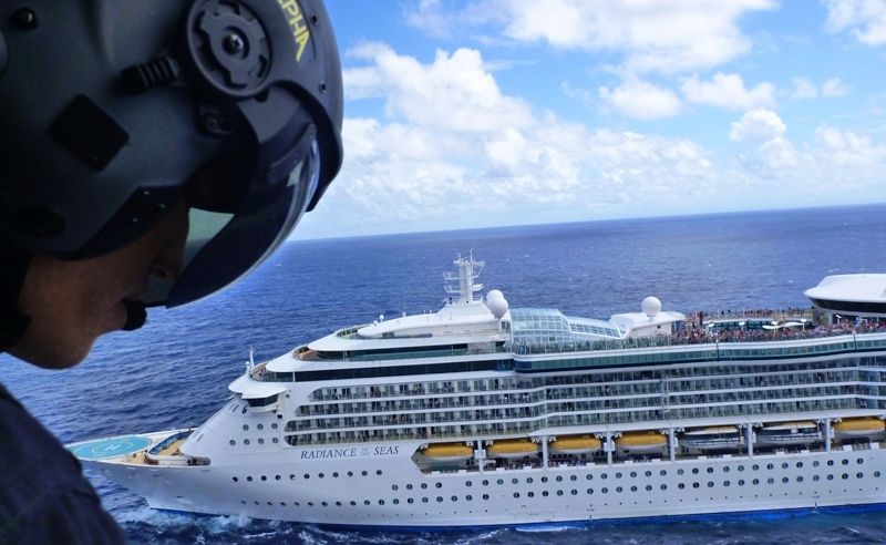 Westpac Life Saver Helicopter crew member Jethro Lampe inspects the landing zone on board the cruise line Radiance of the Seas, in waters north of Coffs Harbour. Westpac Life Saver Helicopter crew member Jethro Lampe inspects the landing zone on board the cruise line Radiance of the Seas, in waters north of Coffs Harbour.
