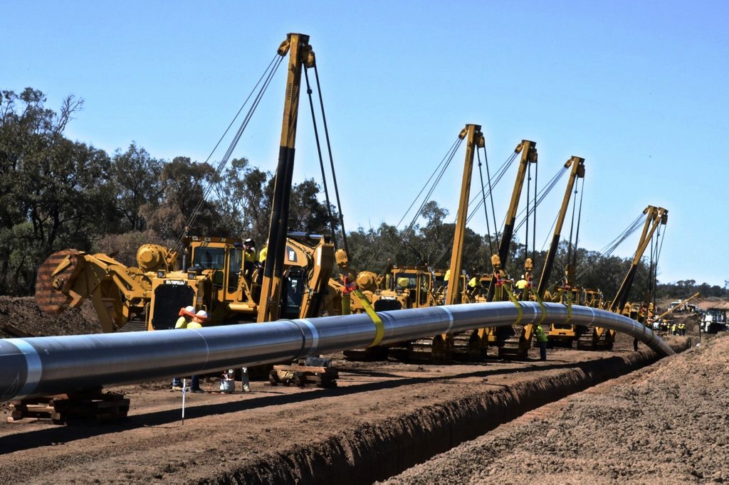 Australia Pacific LNG's main transmission pipeline going into the ground. Photo Contributed Australia Pacific LNG's main transmission pipeline going into the ground. Photo Contributed