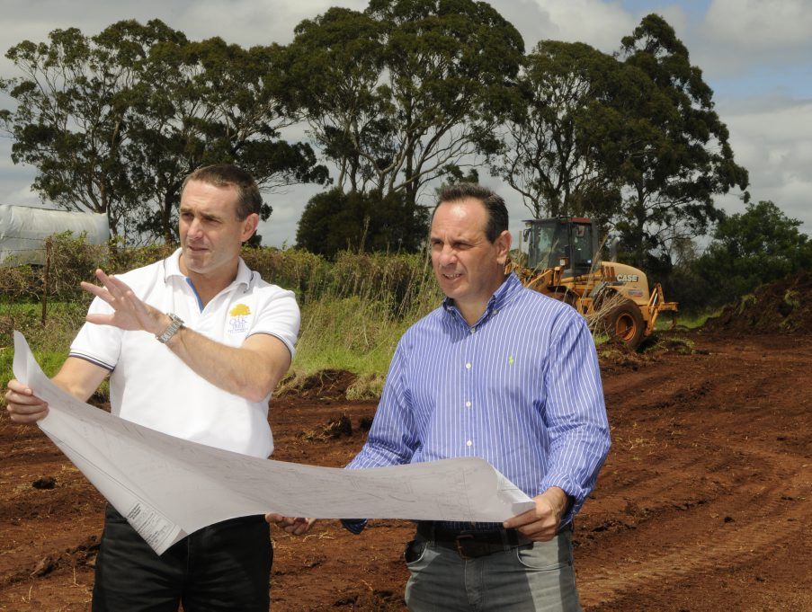  Joint directors of the Oak Tree Group Mark Bindon (left) and Franco De Pasquale go over plans for the new Oak Tree Retirement Village.