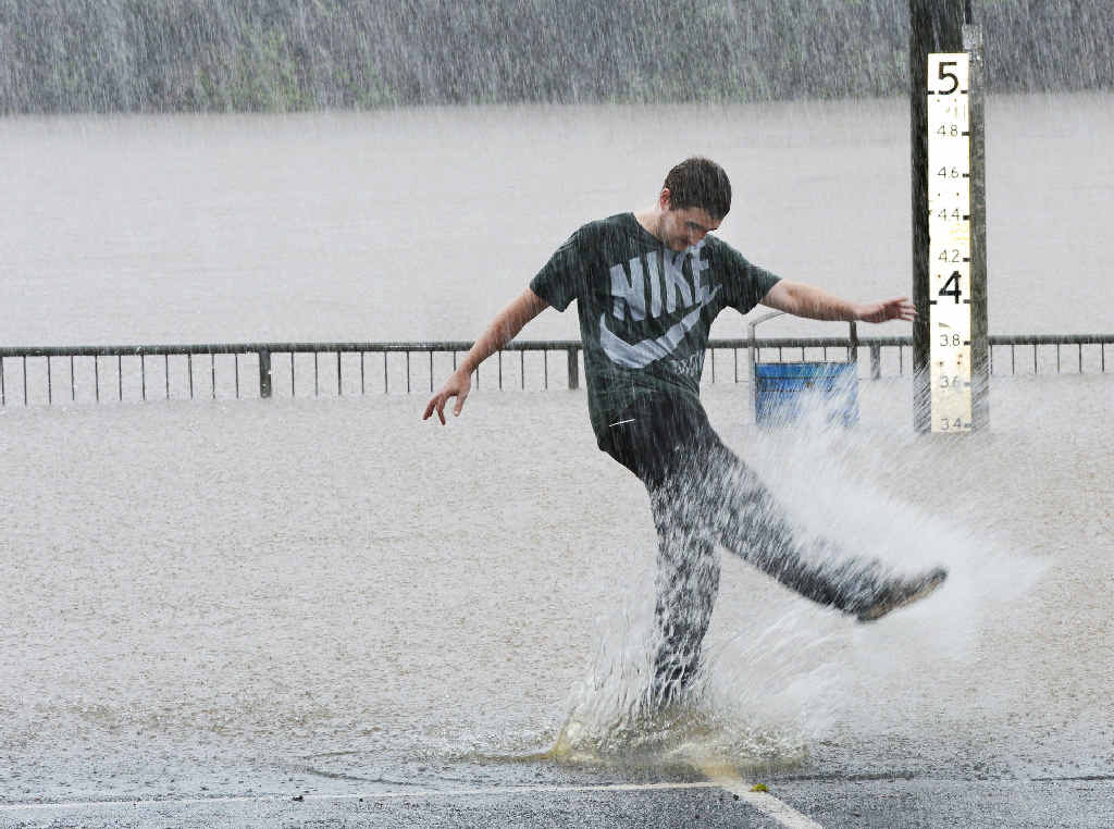 MORE THAN A SPLASH: Lismore man Jake Smith checking out the height of the Wilsons River in the car park behind Lismore Transit Centre, off Magellan St, yesterday. MORE THAN A SPLASH: Lismore man Jake Smith checking out the height of the Wilsons River in the car park behind Lismore Transit Centre, off Magellan St, yesterday.