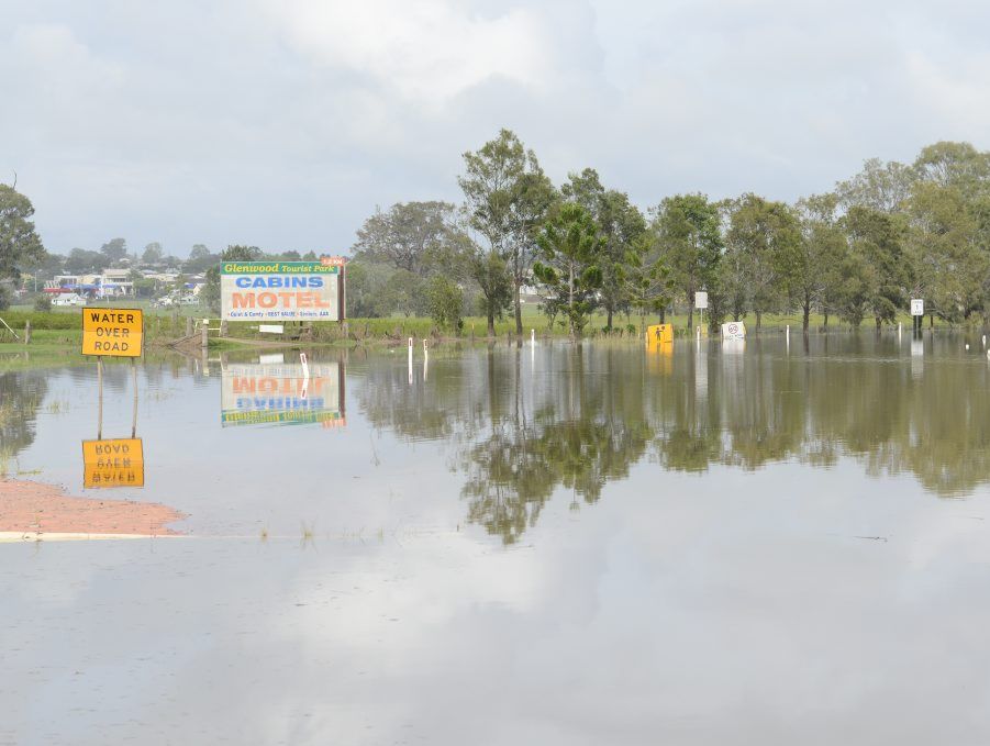 Alipou Creek floods the Pacific Highway on Sunday morning. Photo: Debrah Novak / The Daily Examiner