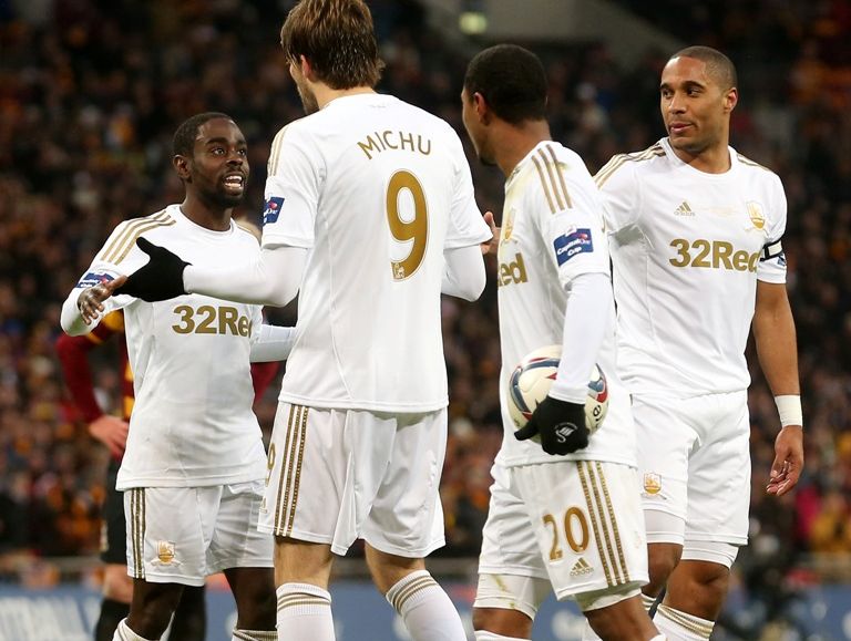 Michu of Swansea City breaks up an arguement between Nathan Dyer of Swansea City and Jonathan de Guzman of Swansea City during the Capital One Cup Final match between Bradford City and Swansea City at Wembley Stadium on February 24, 2013 in London, England. Michu of Swansea City breaks up an arguement between Nathan Dyer of Swansea City and Jonathan de Guzman of Swansea City during the Capital One Cup Final match between Bradford City and Swansea City at Wembley Stadium on February 24, 2013 in London, England.