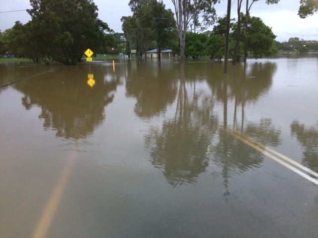 Floodwater over Brisbane Road at One Mile near Gympie. Floodwater over Brisbane Road at One Mile near Gympie.