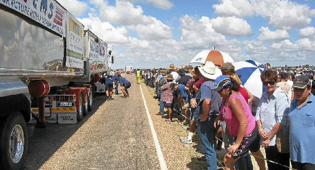 RECORD-BREAKER: The boys double-check everything is hooked up properly for the March 29, 2003, longest road train world record run at Mungindi. RECORD-BREAKER: The boys double-check everything is hooked up properly for the March 29, 2003, longest road train world record run at Mungindi.