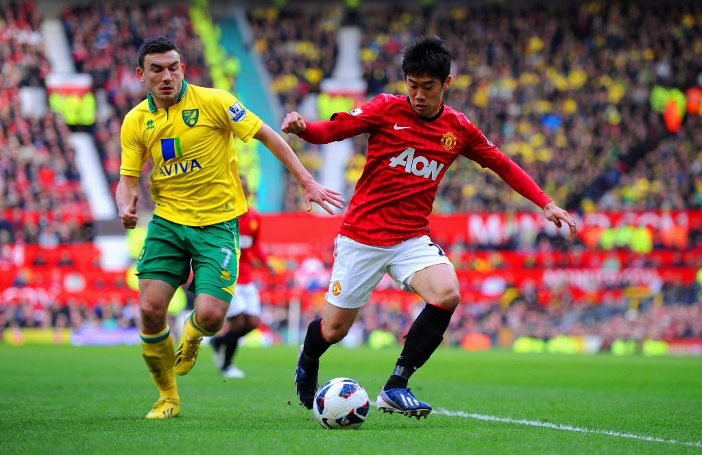 Shinji Kagawa of Manchester United in action with Robert Snodgrass of Norwich during the Barclays Premier League match between Manchester United and Norwich City at Old Trafford on March 2, 2013 in Manchester, England. Shinji Kagawa of Manchester United in action with Robert Snodgrass of Norwich during the Barclays Premier League match between Manchester United and Norwich City at Old Trafford on March 2, 2013 in Manchester, England.
