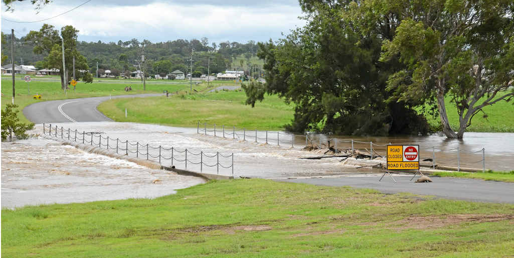 Water covers the Wallace St bridge at 12.30pm yesterday.