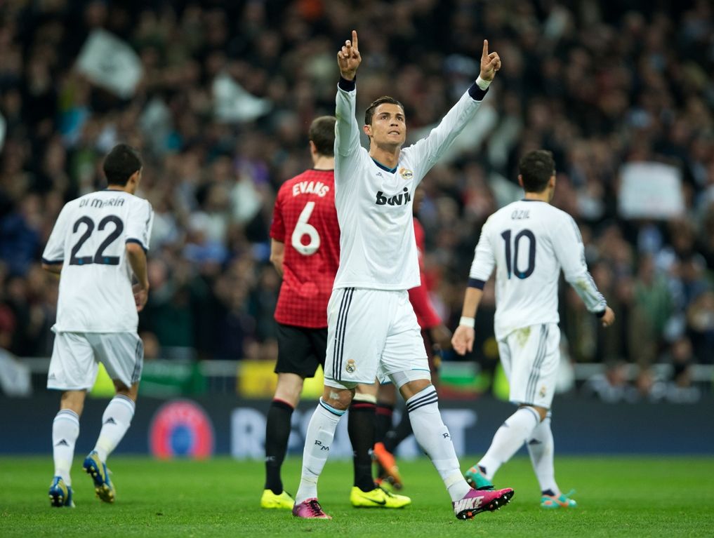 Cristiano Ronaldo of Real Madrid celebrates scoring his sides equalizing goal during the UEFA Champions League Round of 16 first leg match between Real Madrid and Manchester United at Estadio Santiago Bernabeu on February 13, 2013 in Madrid, Spain. Cristiano Ronaldo of Real Madrid celebrates scoring his sides equalizing goal during the UEFA Champions League Round of 16 first leg match between Real Madrid and Manchester United at Estadio Santiago Bernabeu on February 13, 2013 in Madrid, Spain.