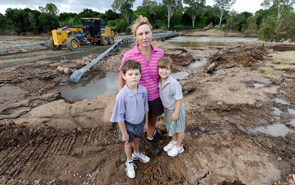 ISOLATED: Denise Bremner with her children Andrew and Samantha at Burtons Bridge, the only access to their Borallon home. ISOLATED: Denise Bremner with her children Andrew and Samantha at Burtons Bridge, the only access to their Borallon home.
