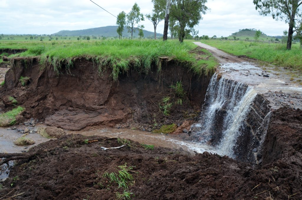 SINK HOLE: Flood waters and torrential rain have caused massive erosion on Scanlans Road, north of Gayndah. Photo Brandon Livesay / Central & North Burnett Times SINK HOLE: Flood waters and torrential rain have caused massive erosion on Scanlans Road, north of Gayndah. Photo Brandon Livesay / Central & North Burnett Times
