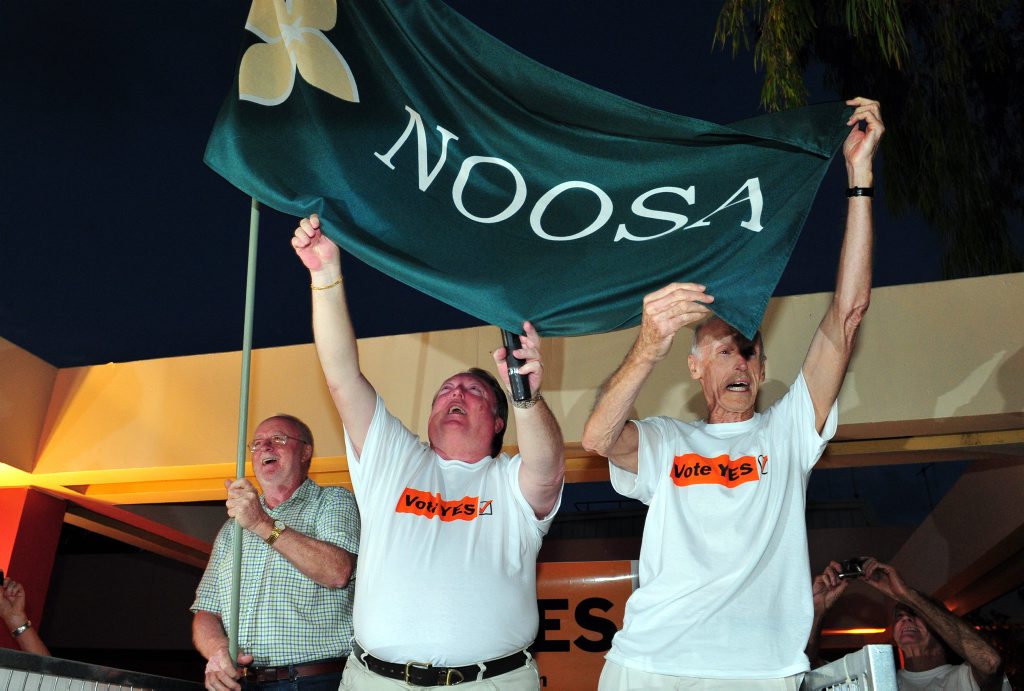 Noel Playford , Member for Noosa Glen Elmes and Friends of Noosa President Bob Ansett celebrate the de-amalgamation victory with hundreds of supporters outside Council Chambers earlier this year. Noel Playford , Member for Noosa Glen Elmes and Friends of Noosa President Bob Ansett celebrate the de-amalgamation victory with hundreds of supporters outside Council Chambers earlier this year.