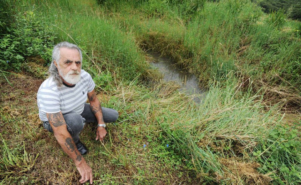 David Spiteri of Rosebank at the spot where his ride on mower overturned, taking him into the dam. David Spiteri of Rosebank at the spot where his ride on mower overturned, taking him into the dam.