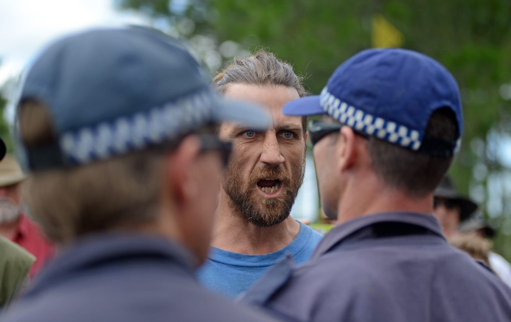 A protester screams at Police at The Doubtful Creek CSG mining site. A protester screams at Police at The Doubtful Creek CSG mining site.
