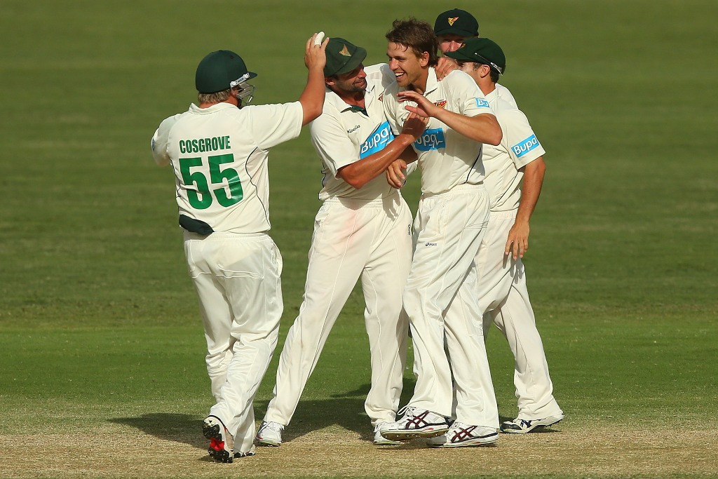 Luke Butterworth of the Tigers celebrates with team mates after dismissing Chris Hartley of the Bulls during day four of the Sheffield Shield match between the Queensland Bulls and the Tasmanian Tigers at The Gabba on March 10, 2013 in Brisbane, Australia. Luke Butterworth of the Tigers celebrates with team mates after dismissing Chris Hartley of the Bulls during day four of the Sheffield Shield match between the Queensland Bulls and the Tasmanian Tigers at The Gabba on March 10, 2013 in Brisbane, Australia.