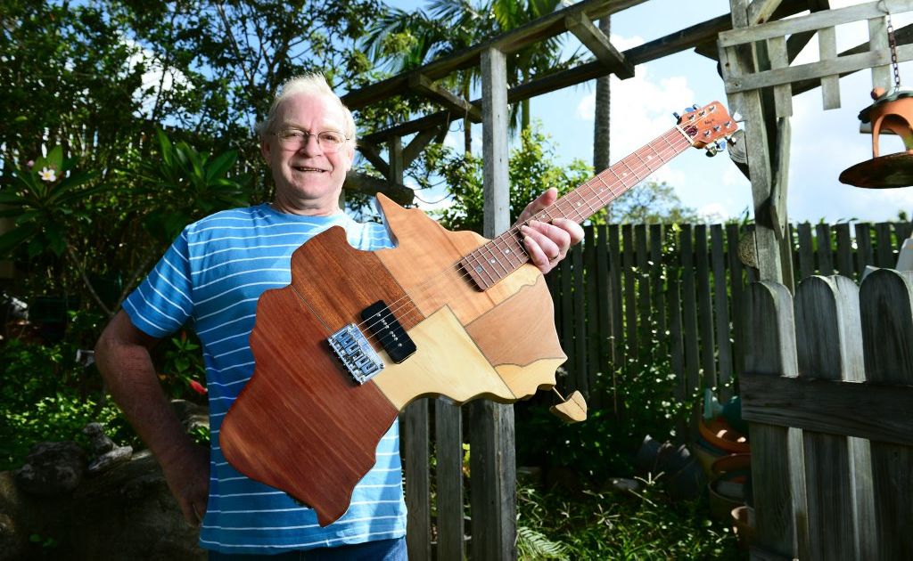 Woodworker and Guitar maker Ray Mole of Collingwood Park with his map of Australia guitar. Woodworker and Guitar maker Ray Mole of Collingwood Park with his map of Australia guitar.