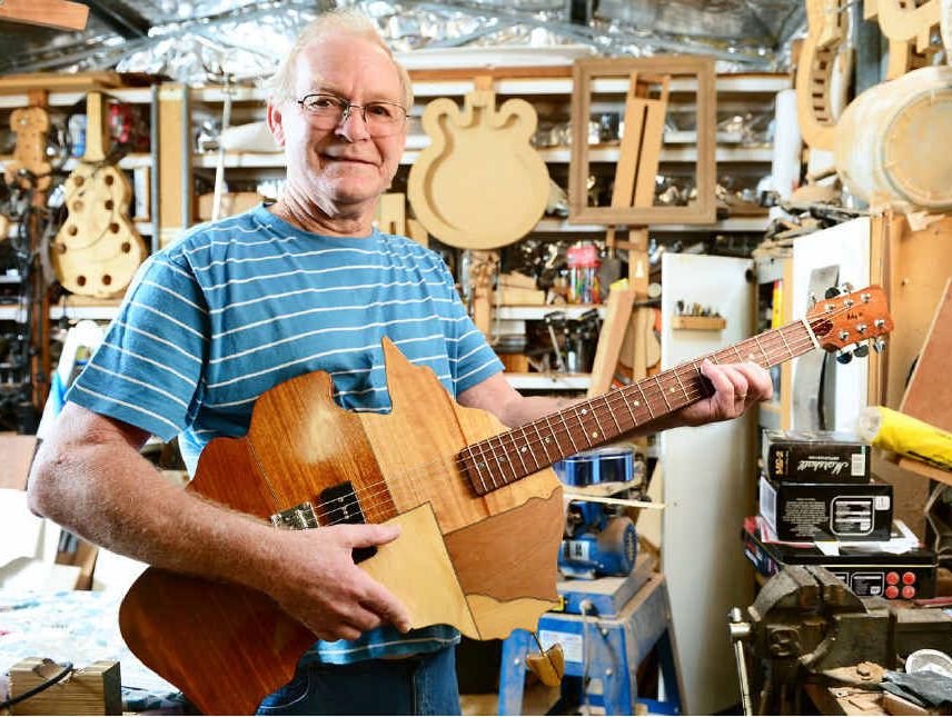 STATE-OF-THE-ART: Woodworker and guitar maker Ray Mole of Collingwood Park with his map of Australia guitar. STATE-OF-THE-ART: Woodworker and guitar maker Ray Mole of Collingwood Park with his map of Australia guitar.