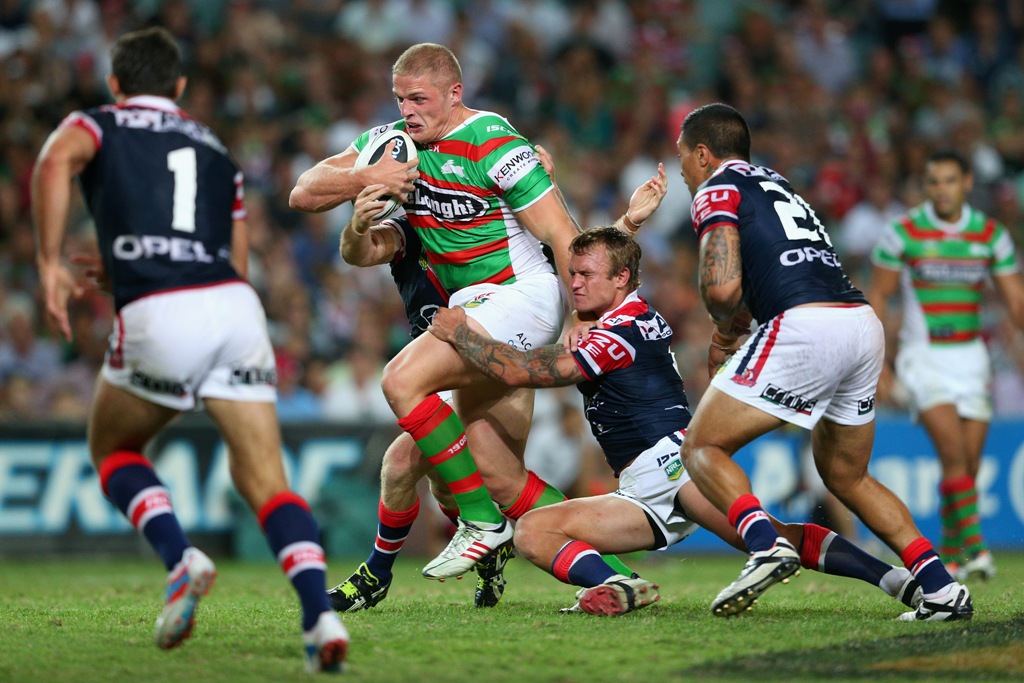 George Burgess of the Rabbitohs is tackled during a match between the Sydney Roosters and the South Sydney Rabbitohs. George Burgess of the Rabbitohs is tackled during a match between the Sydney Roosters and the South Sydney Rabbitohs.