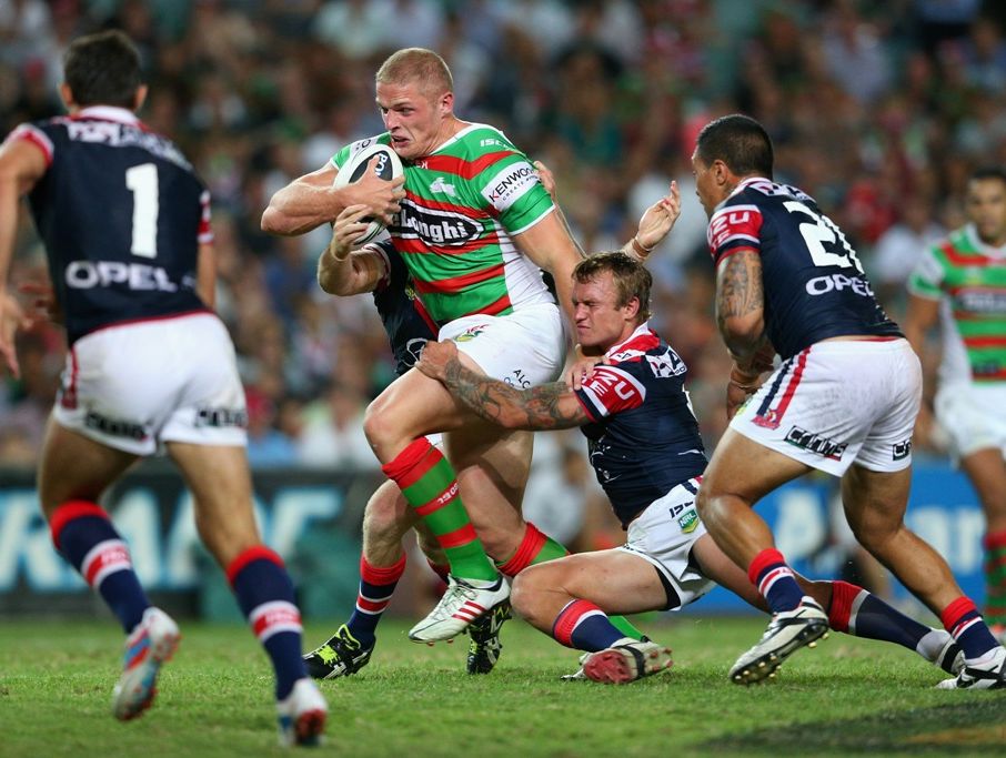 George Burgess of the Rabbitohs is tackled during the round one NRL match between the Sydney Roosters and the South Sydney Rabbitohs at Allianz Stadium on March 7, 2013 in Sydney, Australia.