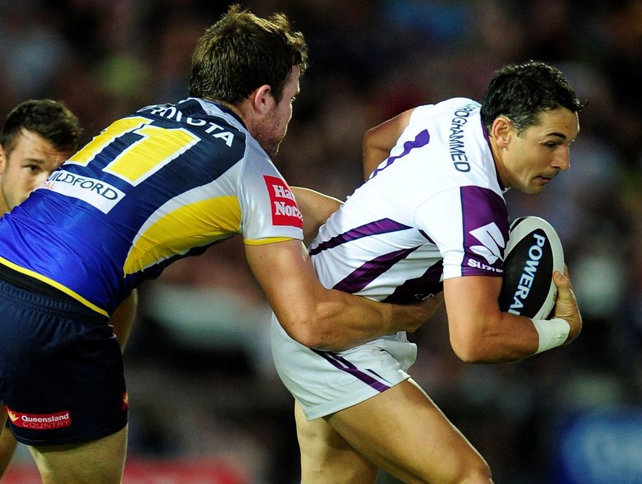 Billy Slater of the Storm is tackled by Gavin Cooper of the Cowboys during the round two NRL match between the North Queensland Cowboys and the Melbourne Storm at 1300SMILES Stadium on March 16, 2013 in Townsville, Australia. Billy Slater of the Storm is tackled by Gavin Cooper of the Cowboys during the round two NRL match between the North Queensland Cowboys and the Melbourne Storm at 1300SMILES Stadium on March 16, 2013 in Townsville, Australia.