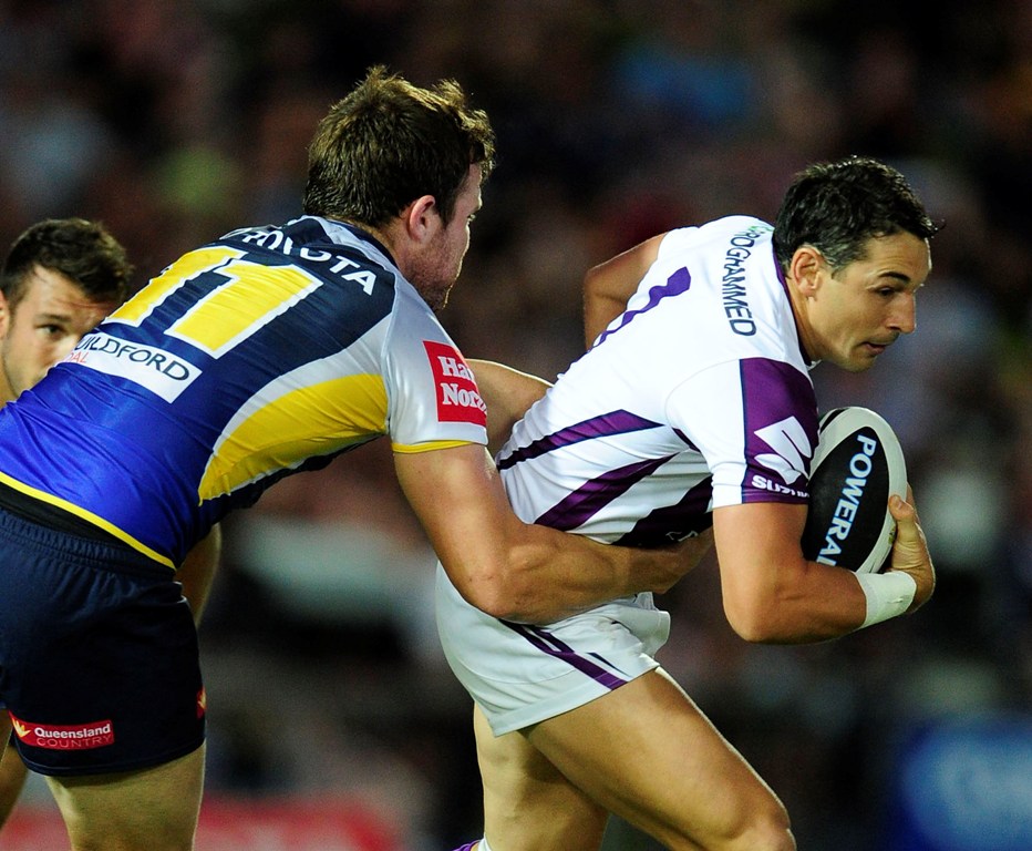 Billy Slater of the Storm is tackled by Gavin Cooper of the Cowboys during the round two NRL match between the North Queensland Cowboys and the Melbourne Storm at 1300SMILES Stadium on March 16, 2013 in Townsville, Australia. Billy Slater of the Storm is tackled by Gavin Cooper of the Cowboys during the round two NRL match between the North Queensland Cowboys and the Melbourne Storm at 1300SMILES Stadium on March 16, 2013 in Townsville, Australia.
