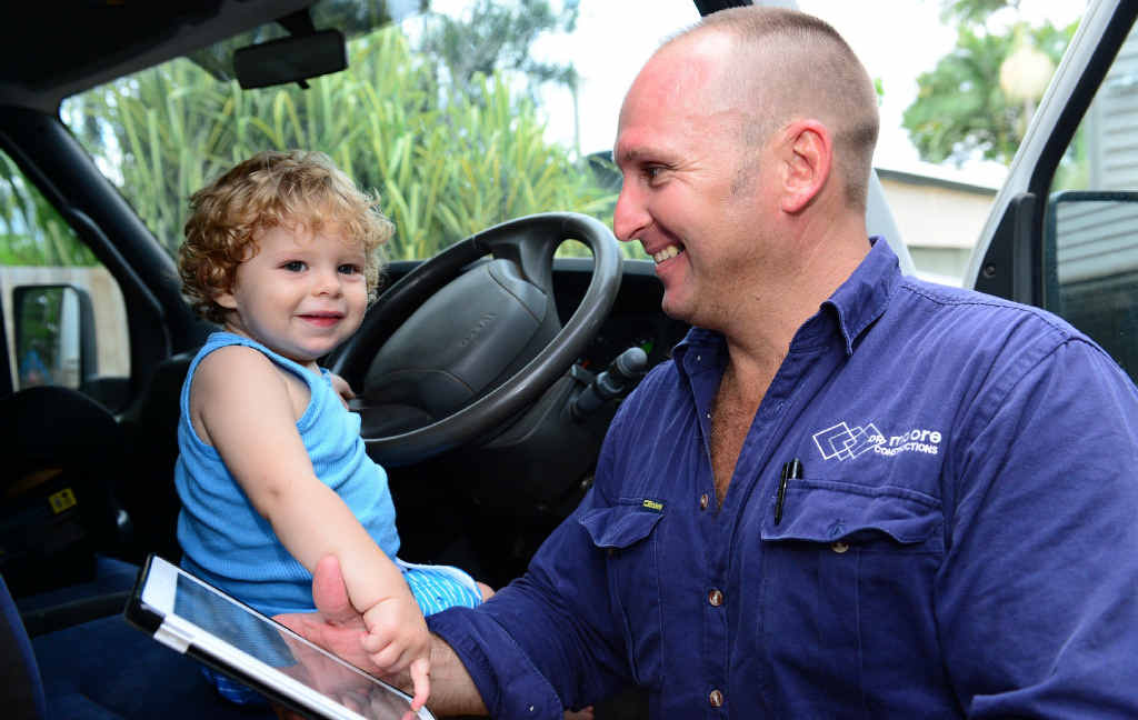 TECH TRADIE: Darren Moore, owner of Rockhampton’s DR Moore Constructions, spends some quality time with his son Oliver, thanks to devices like the iPad. TECH TRADIE: Darren Moore, owner of Rockhampton’s DR Moore Constructions, spends some quality time with his son Oliver, thanks to devices like the iPad.