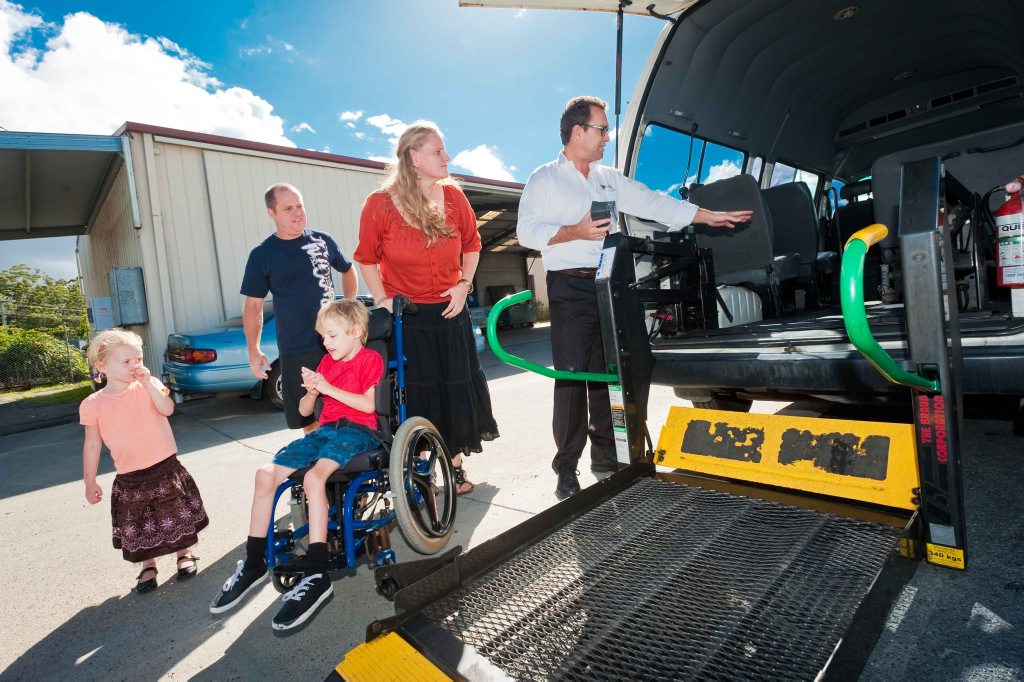 Layla, Mark and Daniel Bennington, Jessica Price are shown the ups and downs of a gifted former Maxi Taxi with lift, by Peter Creenaune from Coffs harbour & Port Maquarie Taxis. Photo: Rob Wright / The Coffs Coast Advocate Layla, Mark and Daniel Bennington, Jessica Price are shown the ups and downs of a gifted former Maxi Taxi with lift, by Peter Creenaune from Coffs harbour & Port Maquarie Taxis. Photo: Rob Wright / The Coffs Coast Advocate