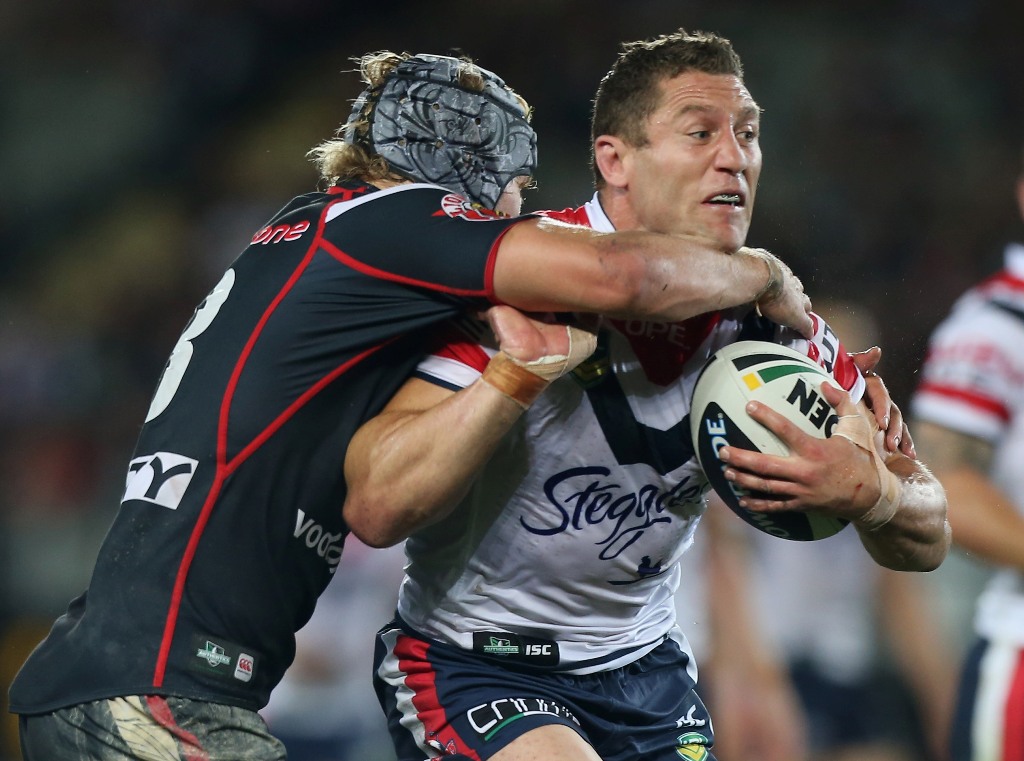 Luke O'Donnell of the Roosters is tackled during the round two NRL match between the New Zealand Warriors and the Sydney Roosters at Eden Park on March 16, 2013 in Auckland, New Zealand. Luke O'Donnell of the Roosters is tackled during the round two NRL match between the New Zealand Warriors and the Sydney Roosters at Eden Park on March 16, 2013 in Auckland, New Zealand.