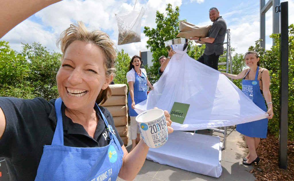 Carolyn Cook with Jodi Durkin, Brian Condon, Greg Walker and Shannan Walker get the measure of their giant teabag. Carolyn Cook with Jodi Durkin, Brian Condon, Greg Walker and Shannan Walker get the measure of their giant teabag.
