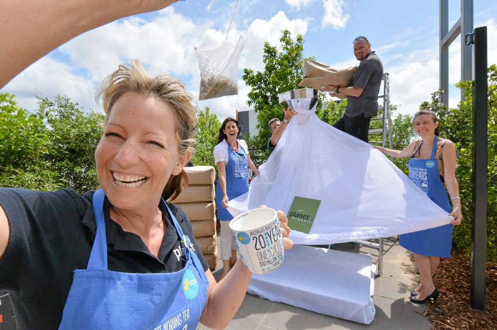 Carolyn Cook with Jodi Durkin, Brian Condon, Greg Walker and Shannan Walker get the measure of their giant teabag. Carolyn Cook with Jodi Durkin, Brian Condon, Greg Walker and Shannan Walker get the measure of their giant teabag.