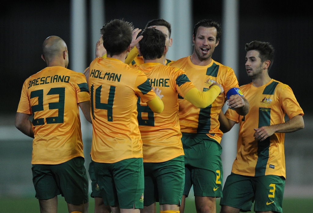 Luke Wilkshire (C) of Australia celebrates with Mark Bresciano (#23), Bret Holman (#14), Lucas Neill (#2) and Michael Zullo after scoring his team's opening goal from the penalty spot during the International Friendly match between Romania and Australia at estadio Ciudad de Malaga on February 6, 2013 in Malaga, Spain. Luke Wilkshire (C) of Australia celebrates with Mark Bresciano (#23), Bret Holman (#14), Lucas Neill (#2) and Michael Zullo after scoring his team's opening goal from the penalty spot during the International Friendly match between Romania and Australia at estadio Ciudad de Malaga on February 6, 2013 in Malaga, Spain.