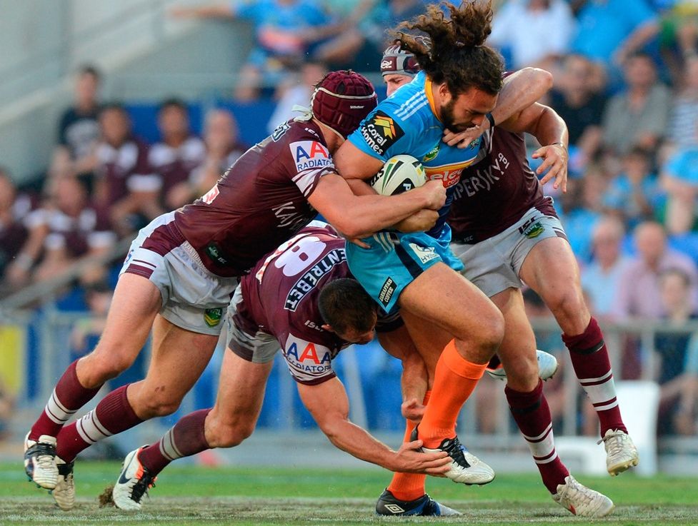 Ryan James of the Titans attempts to push through the defence during the round three NRL match between the Gold Coast Titans and the Manly Sea Eagles at Skilled Park on March 23, 2013 in Gold Coast, Australia. Ryan James of the Titans attempts to push through the defence during the round three NRL match between the Gold Coast Titans and the Manly Sea Eagles at Skilled Park on March 23, 2013 in Gold Coast, Australia.