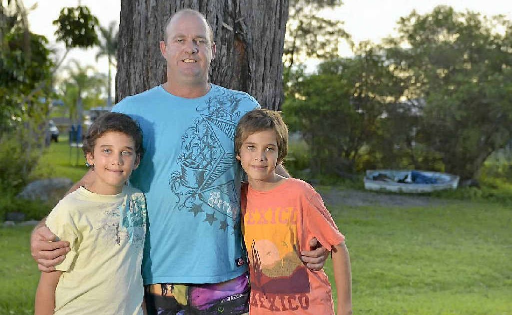 New Auckland resident Ryan Pearce with sons Kyrim, 10, and Brayden, 11. Mr Pearce helped save a teenager who suffered an electric shock while boating in Gladstone. New Auckland resident Ryan Pearce with sons Kyrim, 10, and Brayden, 11. Mr Pearce helped save a teenager who suffered an electric shock while boating in Gladstone.