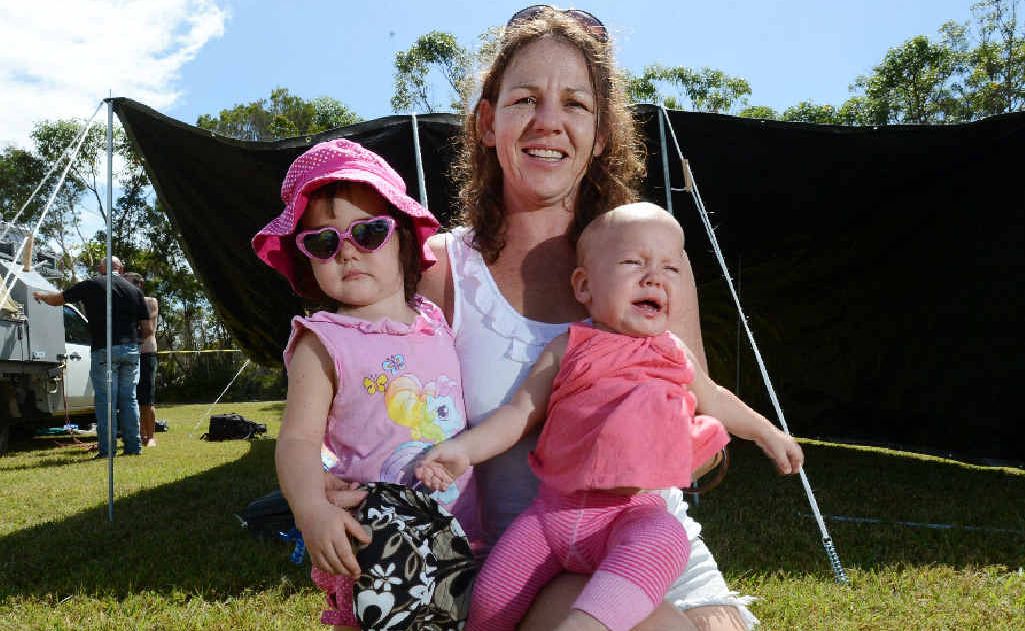 READY TO ROCK: Kate Augl with daughters Tirisuli, 2 and Sienna, 7 months, from Airlie Beach, getting set up. READY TO ROCK: Kate Augl with daughters Tirisuli, 2 and Sienna, 7 months, from Airlie Beach, getting set up.